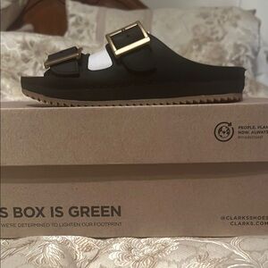 Clarks Black Slides with Gold Accents